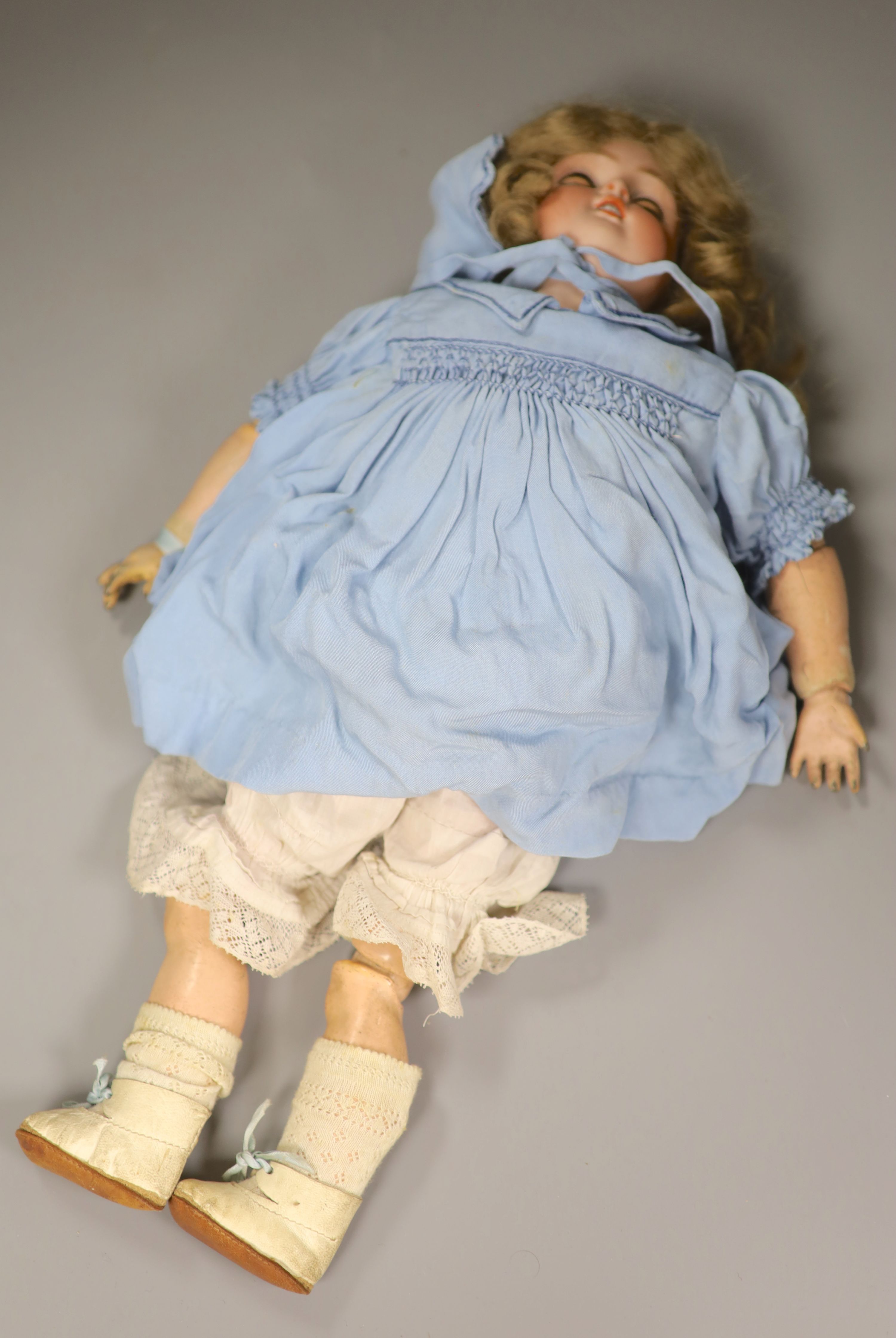 A Kammer and Reinhardt sleeping eyes bisque head doll